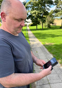 Farmer with the smart app for pig farming